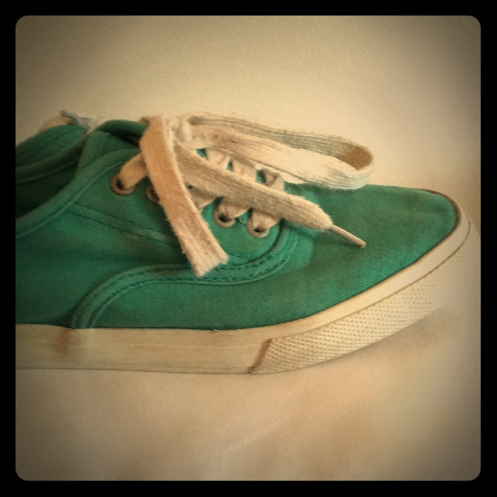 Green laced up style sneakers.  Used